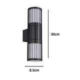 Black metal up and down outdoor wall light with vertical ribbed design