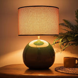 Green round base table lamp with natural fabric lampshade