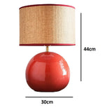 red round base table lamp with natural fabric lampshade