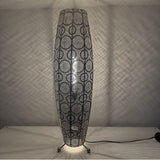 Decorative floor lamp with intricate circular pattern