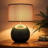 glossy blue ceramic lamp with textured drum shade