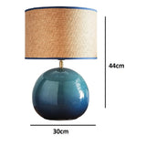 stylish modern lamp with blue base and natural woven shade