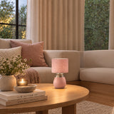 Pink table lamp with fabric drum shade and brushed metal detail