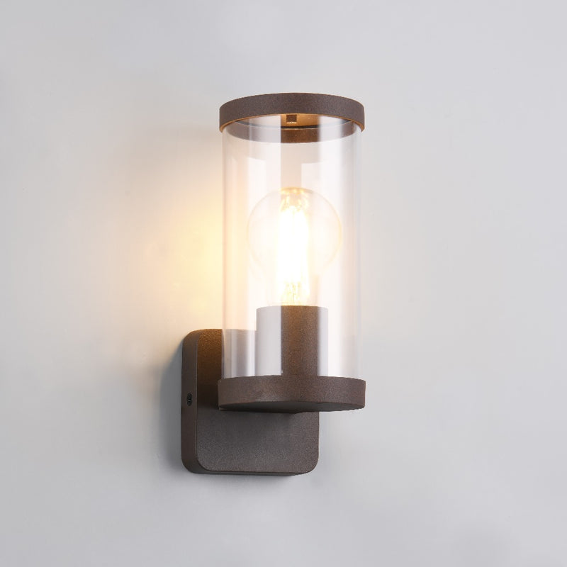 Modern outdoor wall lamp with clear glass cylinder and bronze metal finish