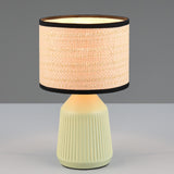 Decorative ceramic table lamp with ribbed green base and rattan shade