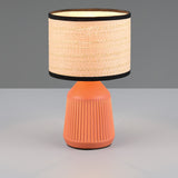 Boho style table lamp with terracotta base and woven lampshade